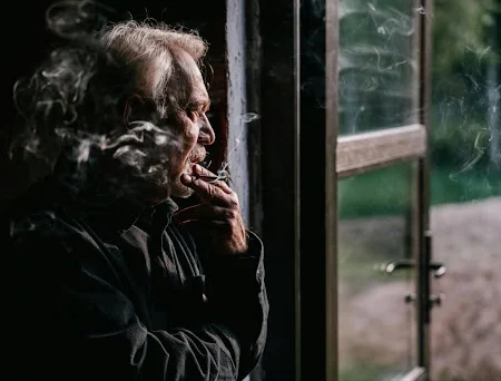 Man with COPD smoking.