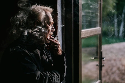 Man with COPD smoking.