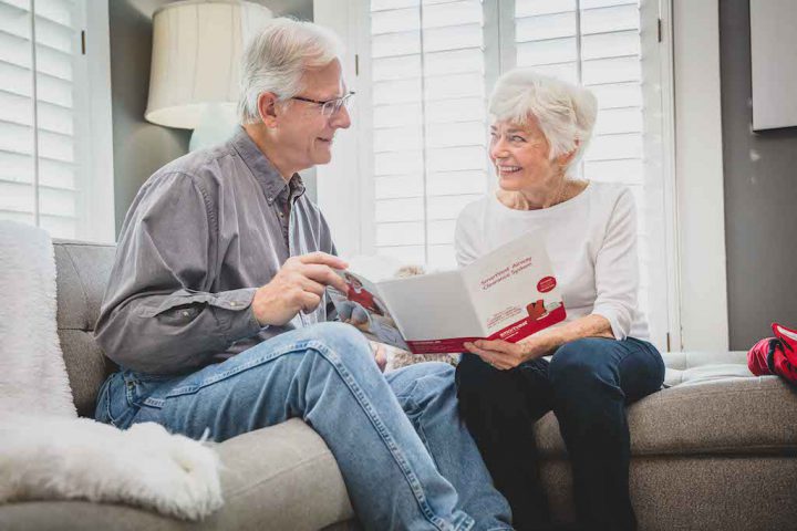A couple looks through their SmartVest patient packet