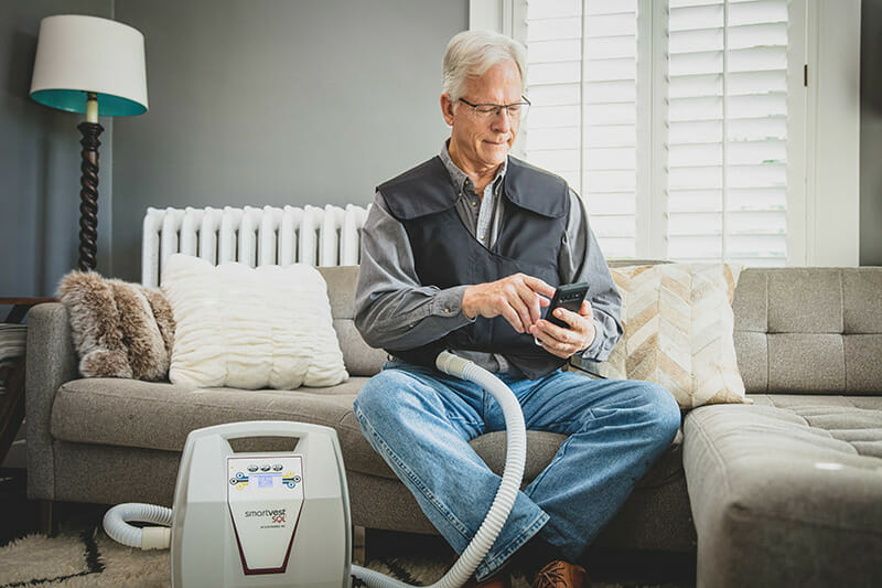 Man wearing SmartVest and using SmartVest Connect