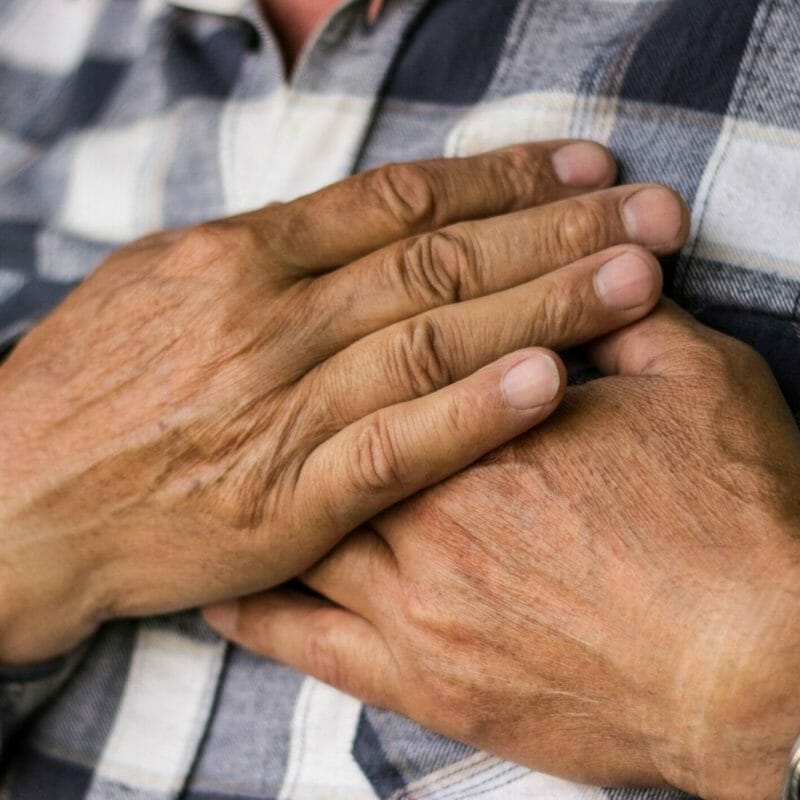 Man holding chest