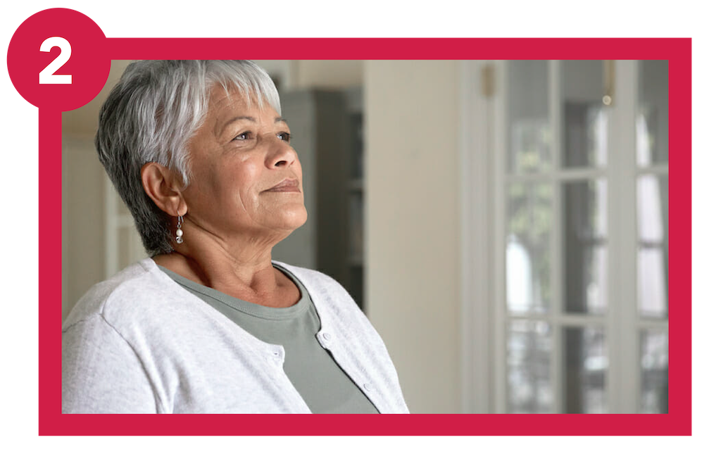 Woman living with lung condition practicing breathing exercise.