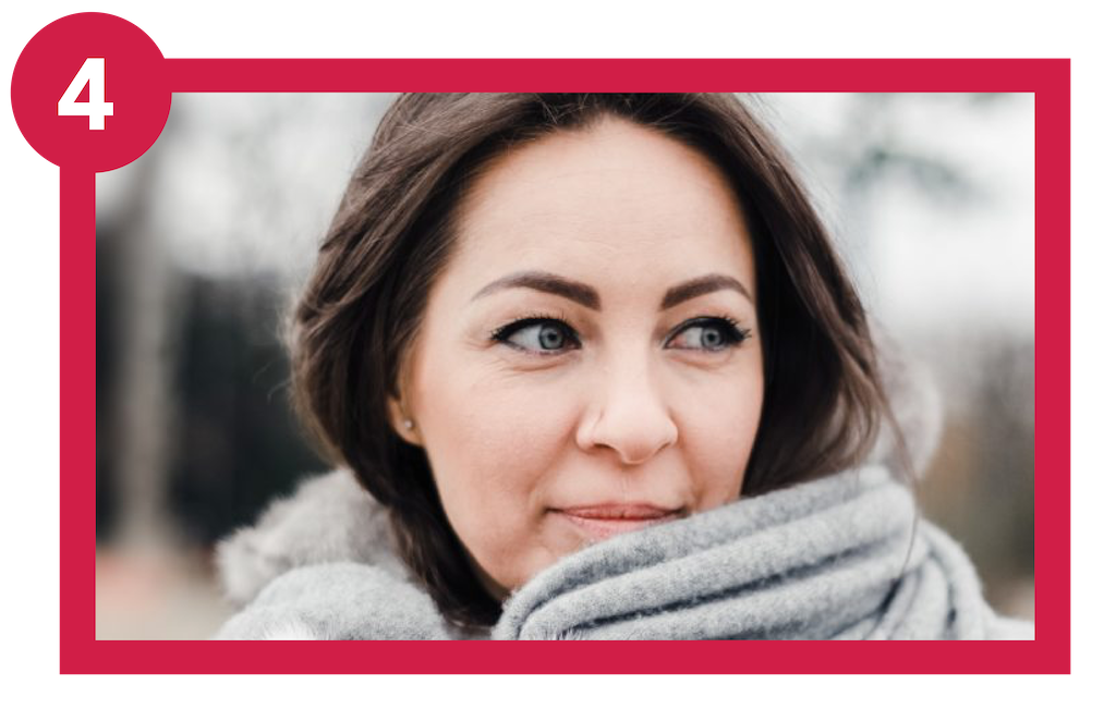 Young woman living with COPD, wearing scarf outside to protect lungs.