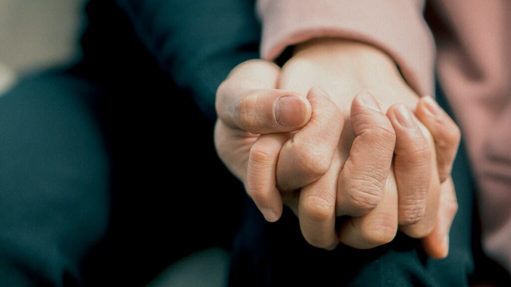 Man holding woman's hand; finding support for chronic lung condition