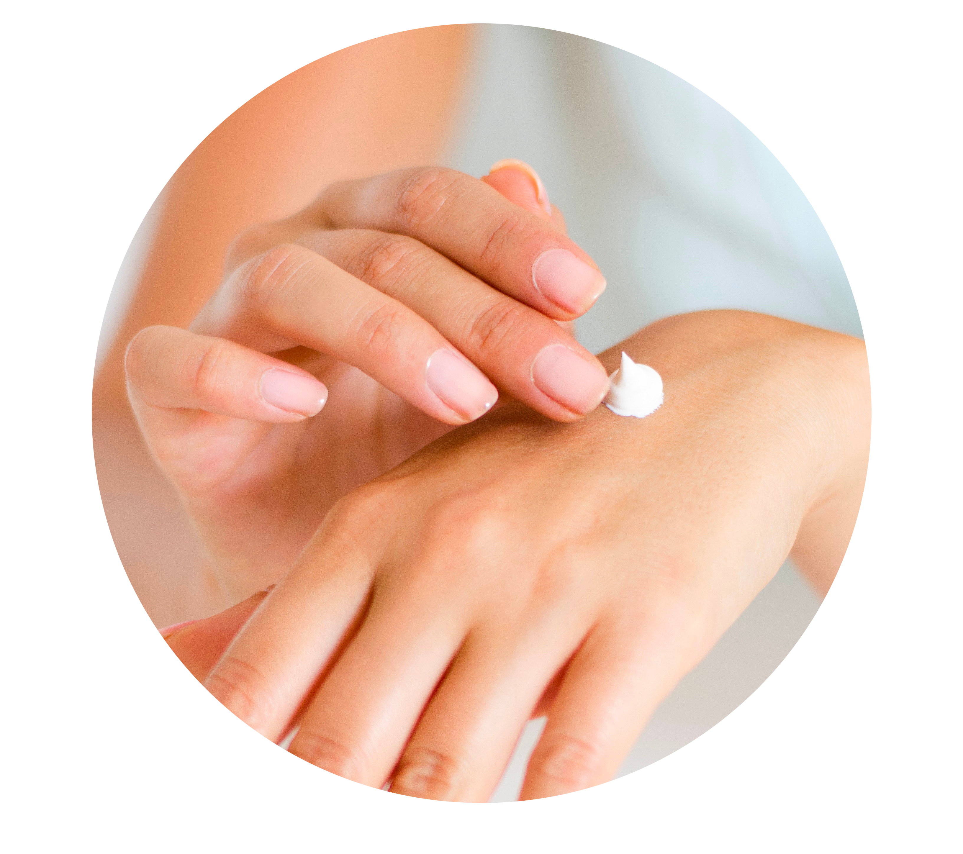 Woman using lotion on dry skin of hands