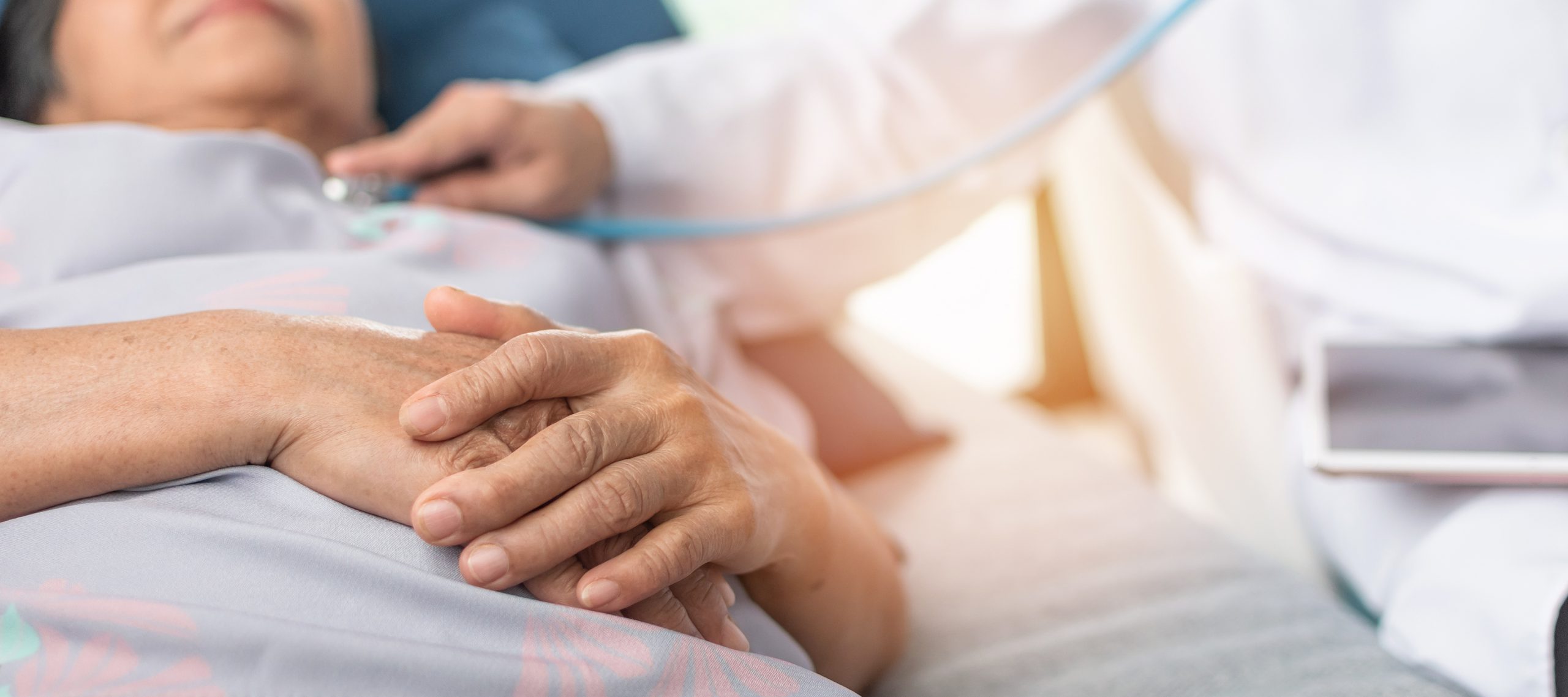 Hospitalized elderly patient getting treatment for respiratory condition