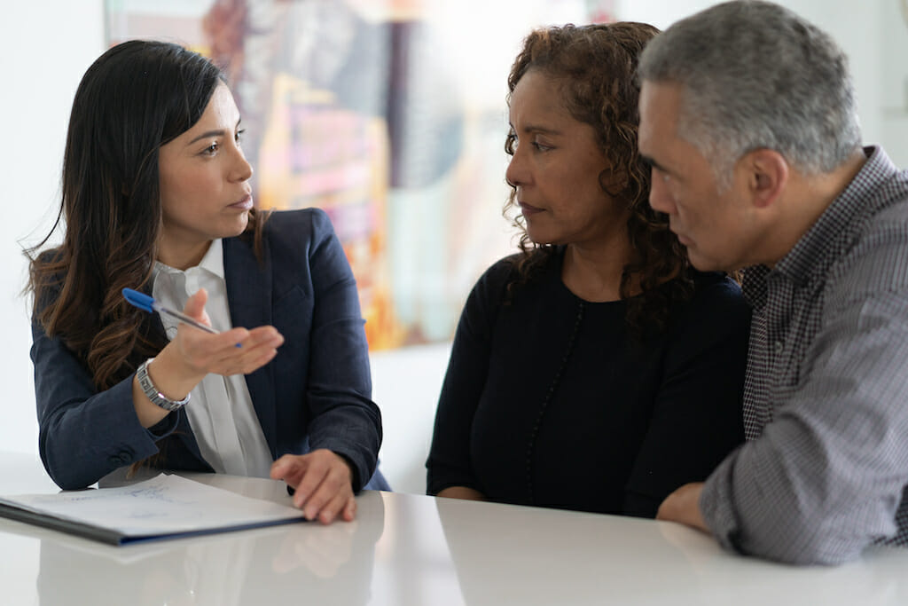 A couple meeting with clinician to review COPD action plan.