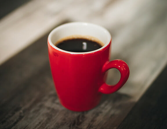 A red mug of coffee