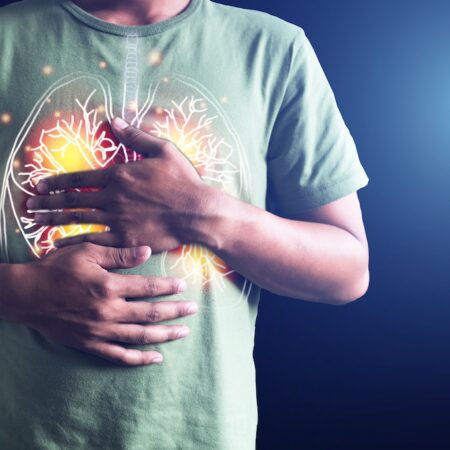 Man holding his chest.