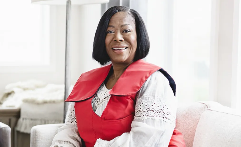 woman smiling with smartvest on