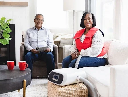 Woman wearing SmartVest in a living room